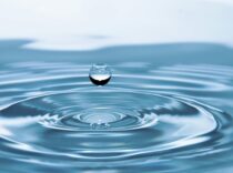 A mesmerizing shot of a water droplet capturing the beauty of liquid dynamics.